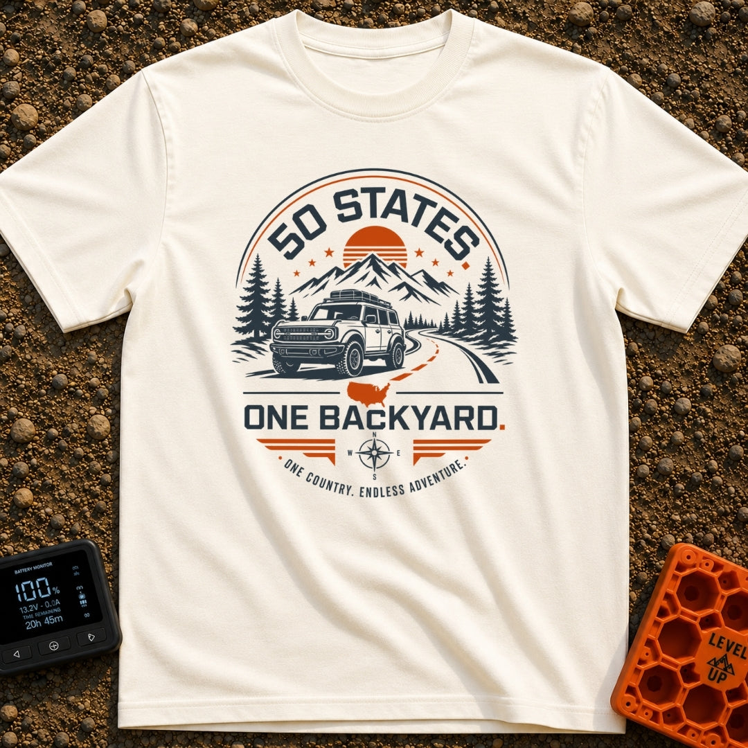 Fifty State Backyard - T-Shirt in Ivory - A circular badge design featuring an off-road SUV parked next to a winding...