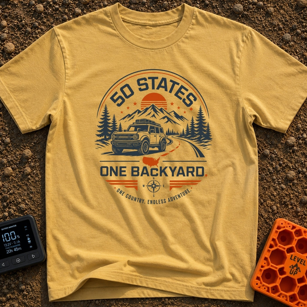 Fifty State Backyard - T-Shirt in Mustard - A circular badge design featuring an off-road SUV parked next to a winding...