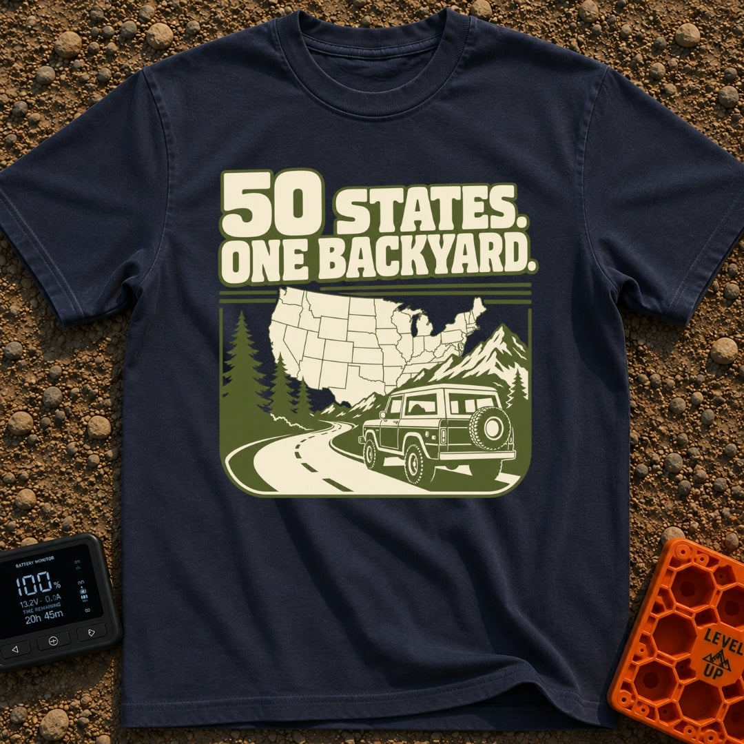 Every State Playground - T-Shirt in Navy - A green and cream illustration featuring the text "50 STATES. ONE BACKYARD."...