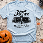 Backing Into The Abyss - T-Shirt in Chambray - A black and white illustration of a vehicle's rearview mirror reflecting a...
