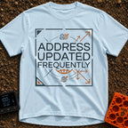 No Fixed Address - T-Shirt in Chambray - The text "ADDRESS UPDATED FREQUENTLY" is centered inside a square border with...