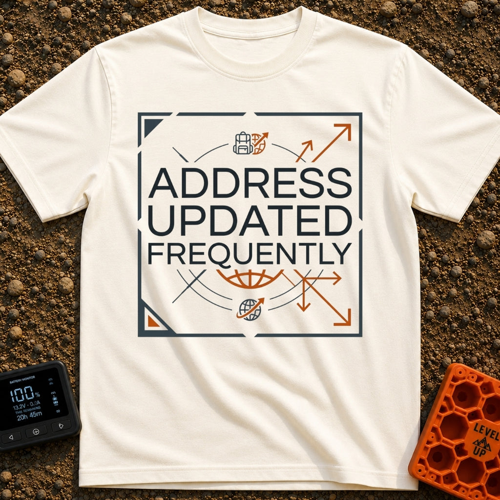 No Fixed Address - T-Shirt in Ivory - The text "ADDRESS UPDATED FREQUENTLY" is centered inside a square border with...