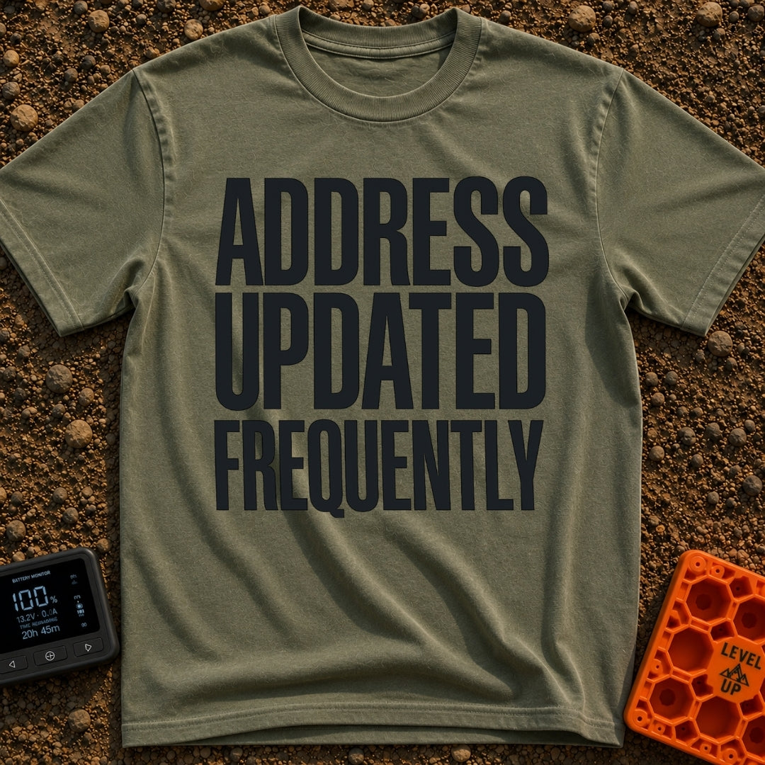 Location Not Found - T-Shirt in Moss - A text-only design featuring the phrase "ADDRESS UPDATED FREQUENTLY" stacked in...