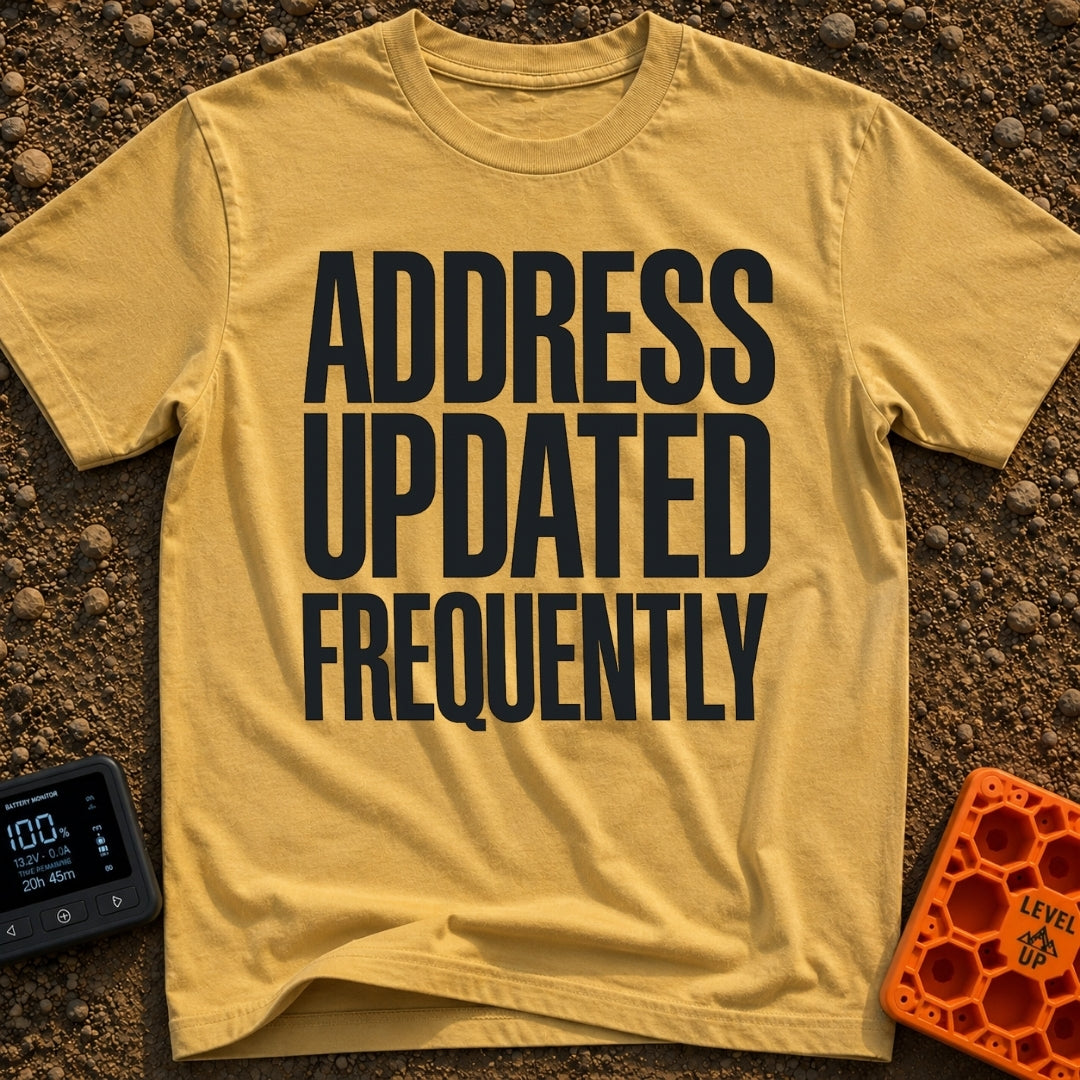 Location Not Found - T-Shirt in Mustard - A text-only design featuring the phrase "ADDRESS UPDATED FREQUENTLY" stacked in...