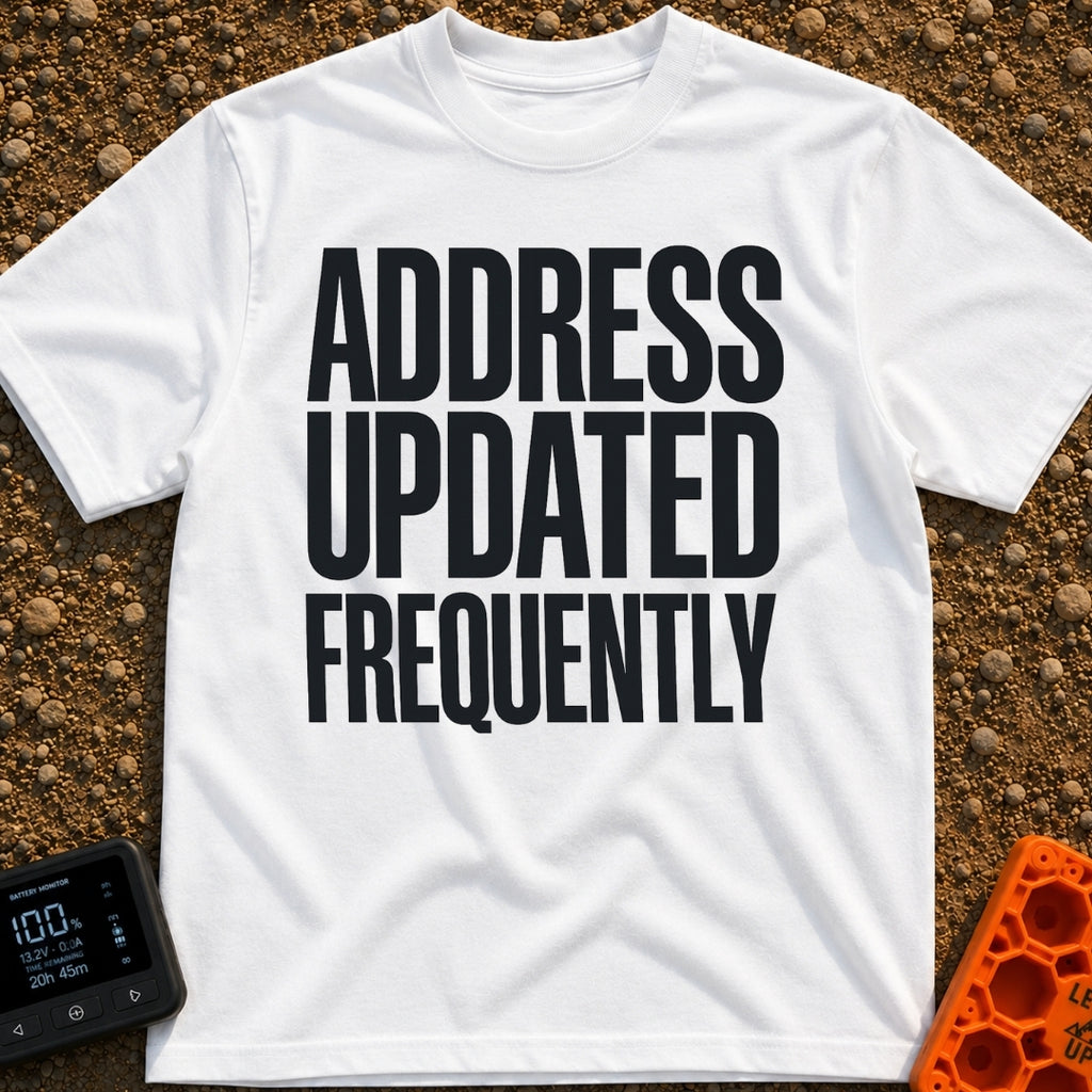 Location Not Found - T-Shirt in White - A text-only design featuring the phrase "ADDRESS UPDATED FREQUENTLY" stacked in...