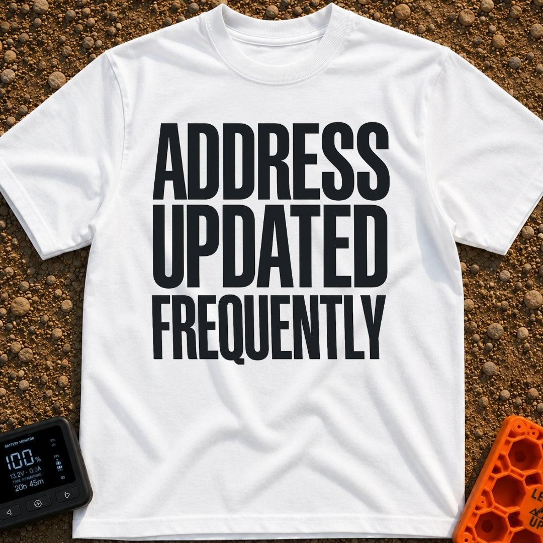 Location Not Found - T-Shirt in White - A text-only design featuring the phrase "ADDRESS UPDATED FREQUENTLY" stacked in...