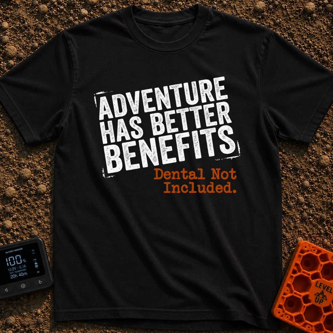 Dental Not Included - T-Shirt in Black - A text-based design featuring the phrase "ADVENTURE HAS BETTER BENEFITS" in a...