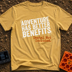 Dental Not Included - T-Shirt in Mustard - A text-based design featuring the phrase "ADVENTURE HAS BETTER BENEFITS" in a...