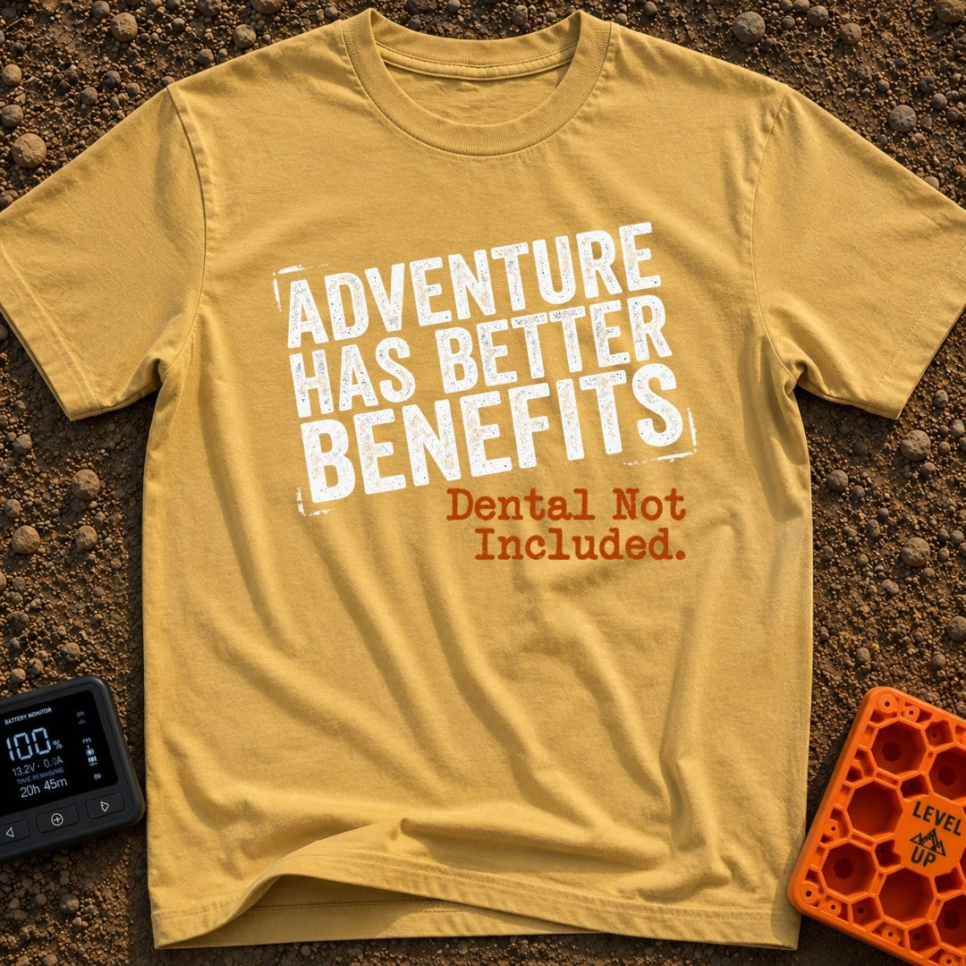 Dental Not Included - T-Shirt in Mustard - A text-based design featuring the phrase "ADVENTURE HAS BETTER BENEFITS" in a...