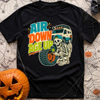 Aired Down Aged Up - T-Shirt in Black - A cartoon skeleton wearing a backwards baseball cap gives a thumbs-up while using...