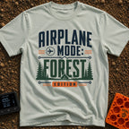 Forest On Airplane Mode - T-Shirt in Bay - A typographic design reading "AIRPLANE MODE: FOREST EDITION" featuring an...