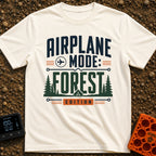 Forest On Airplane Mode - T-Shirt in Ivory - A typographic design reading "AIRPLANE MODE: FOREST EDITION" featuring an...