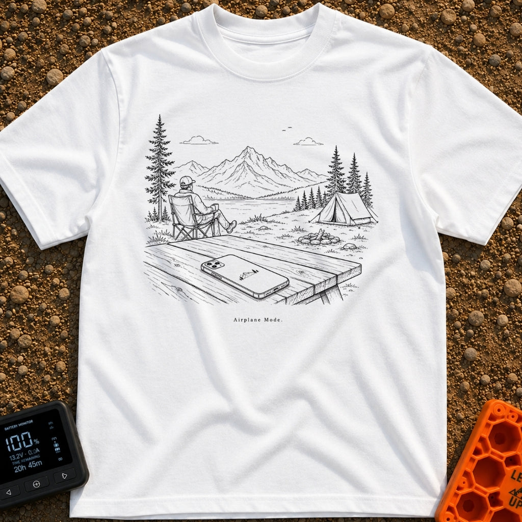 The Real Airplane Mode - T-Shirt in White - A black and white line drawing of a smartphone resting on a wooden picnic...