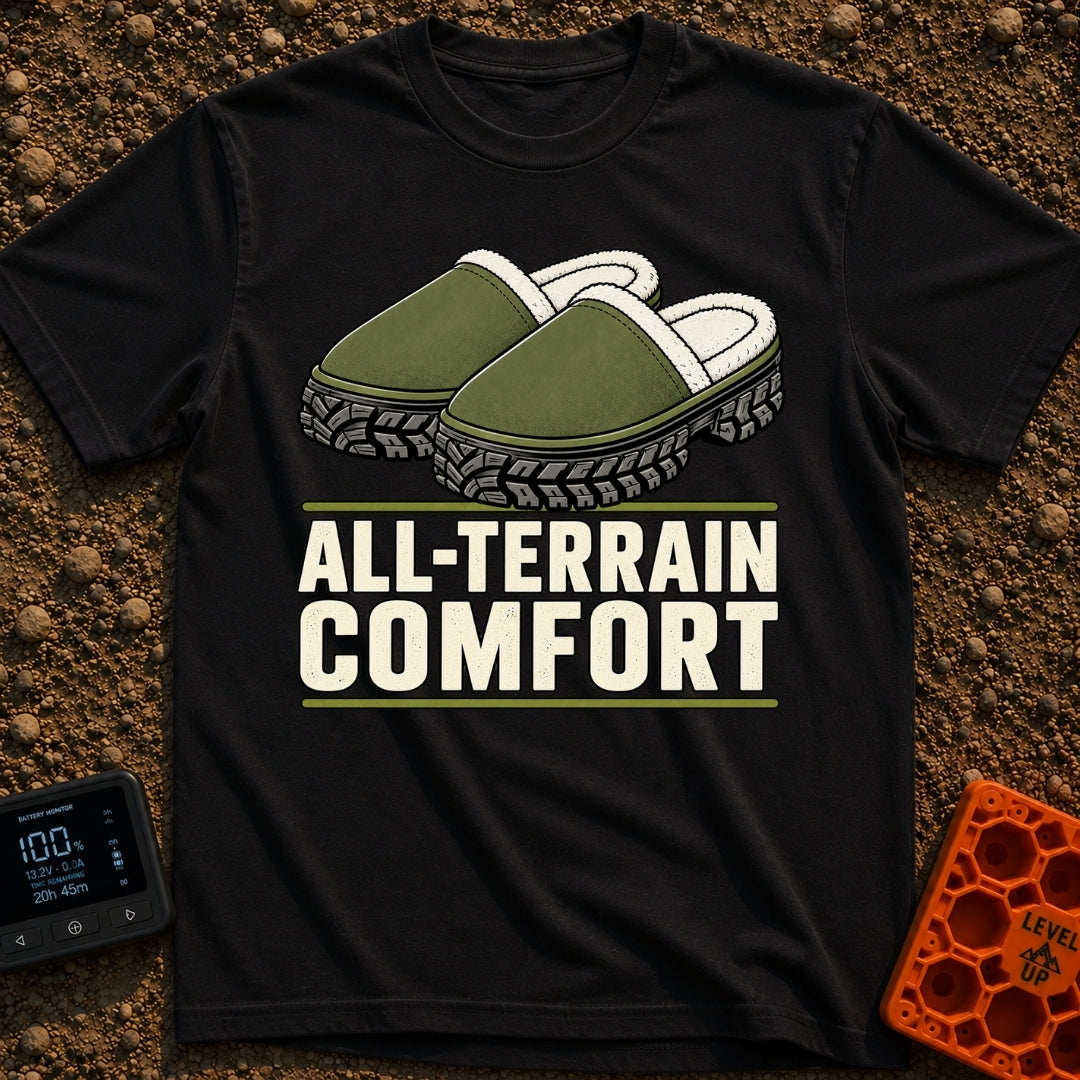 Four Wheel Lounge - T-Shirt in Black - An illustration of a pair of green, fleece-lined slippers that have thick,...