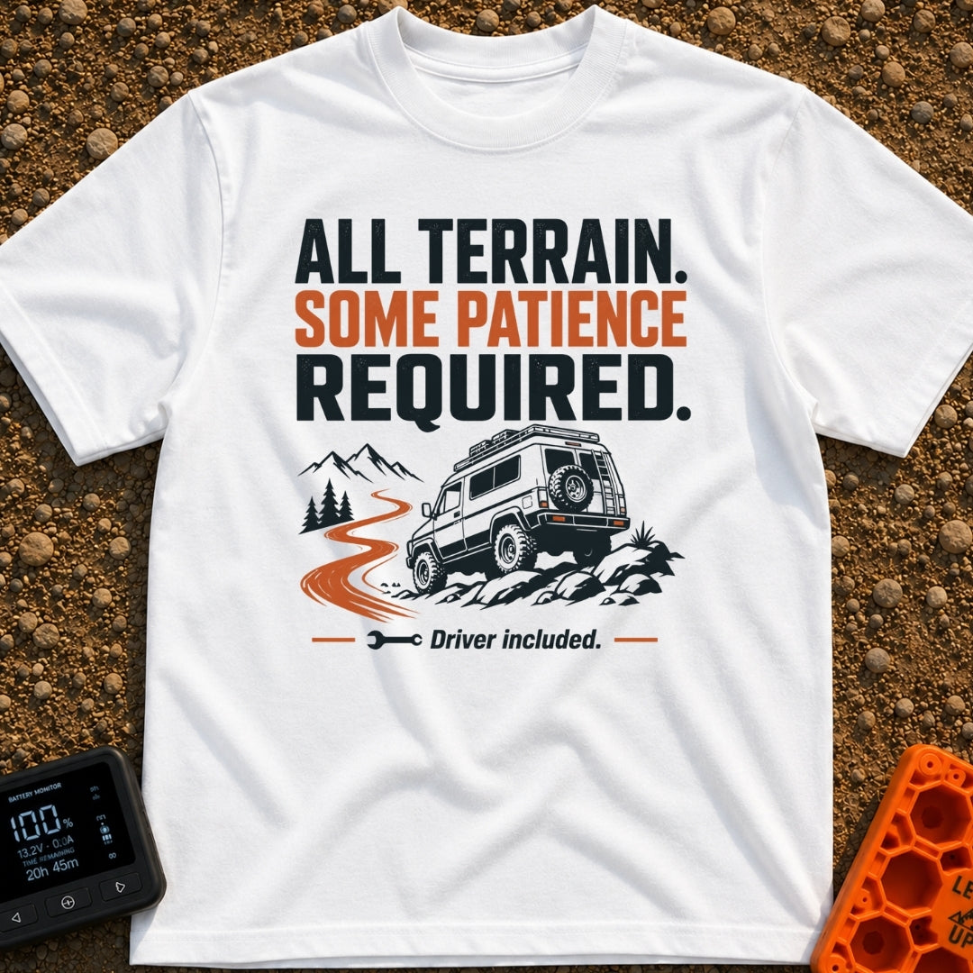 All Terrain Patience Required - T-Shirt in White - A rugged camper van is shown driving over a rocky surface beside a...