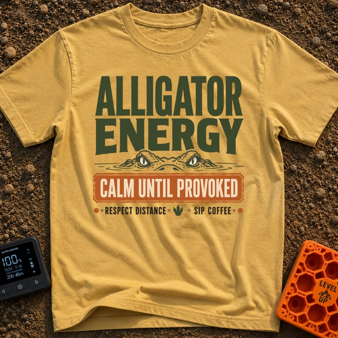 Calm Until Provoked - T-Shirt in Mustard - The artwork features the top half of an alligator's head with its eyes peering...
