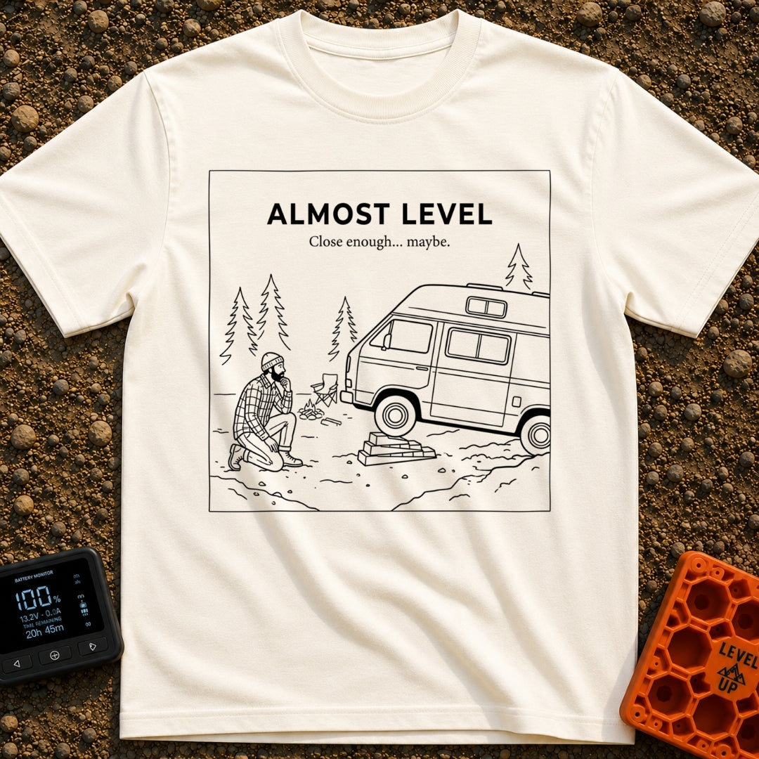 Looks Level From Here - T-Shirt in Ivory - A black-and-white line drawing of a bearded man kneeling and thoughtfully...