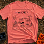 Looks Level From Here - T-Shirt in Watermelon - A black-and-white line drawing of a bearded man kneeling and thoughtfully...