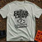 Check Engine Night Light - T-Shirt in Bay - A distressed typographic design that reads "THE CHECK ENGINE LIGHT Is Just...