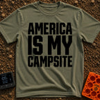 America Is My Campsite - T-Shirt in Moss - Bold, black, uppercase text reading "AMERICA IS MY CAMPSITE" stacked in three...
