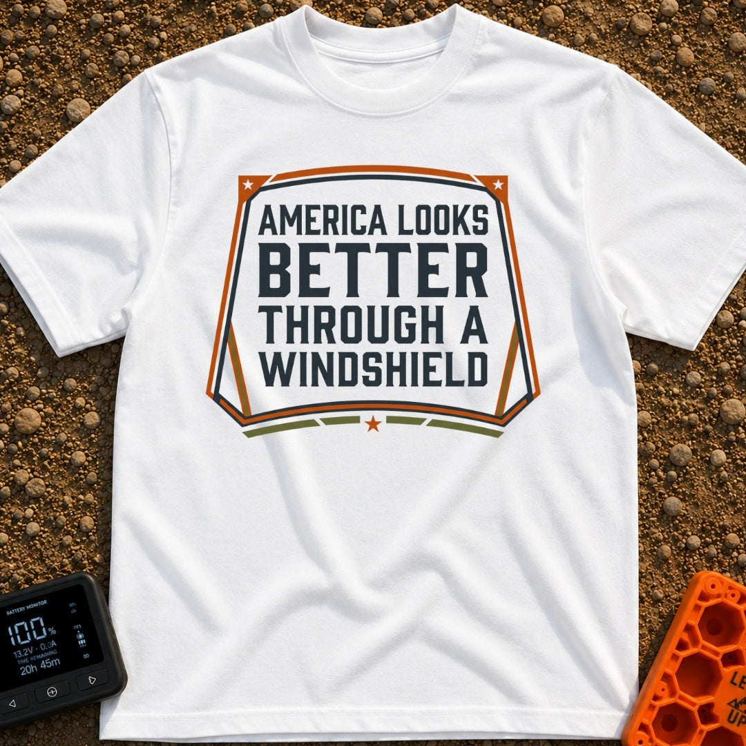 Better Through A Windshield - T-Shirt in White - A typographic design featuring the phrase "AMERICA LOOKS BETTER THROUGH...