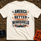 Better Through A Windshield - T-Shirt in Ivory - Text reading "AMERICA LOOKS BETTER THROUGH A WINDSHIELD" surrounded by...