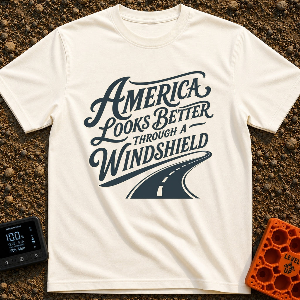 Better Through A Windshield - T-Shirt in Ivory - Stylized typography reading "America Looks Better Through A Windshield"...