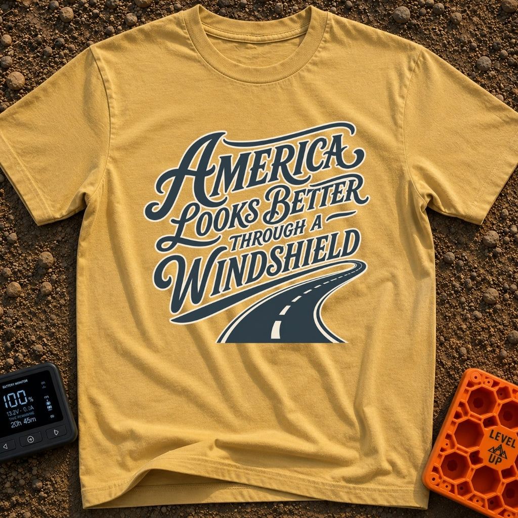 Better Through A Windshield - T-Shirt in Mustard - Stylized typography reading "America Looks Better Through A...