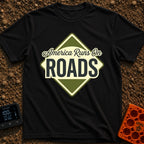 America runs On Roads - T-Shirt in Black - A diamond-shaped, olive green and pale yellow graphic resembling a road sign...