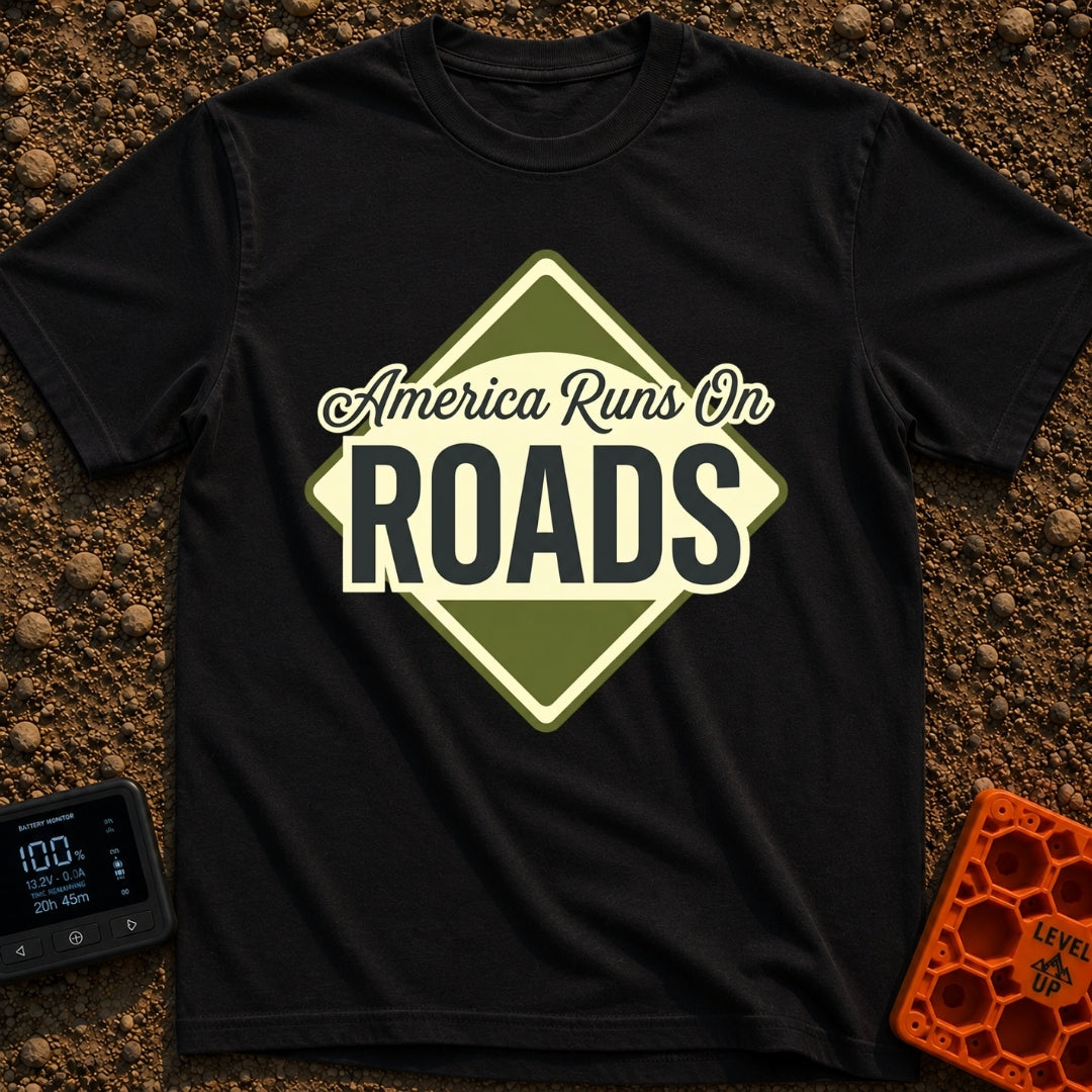 America runs On Roads - T-Shirt in Black - A diamond-shaped, olive green and pale yellow graphic resembling a road sign...