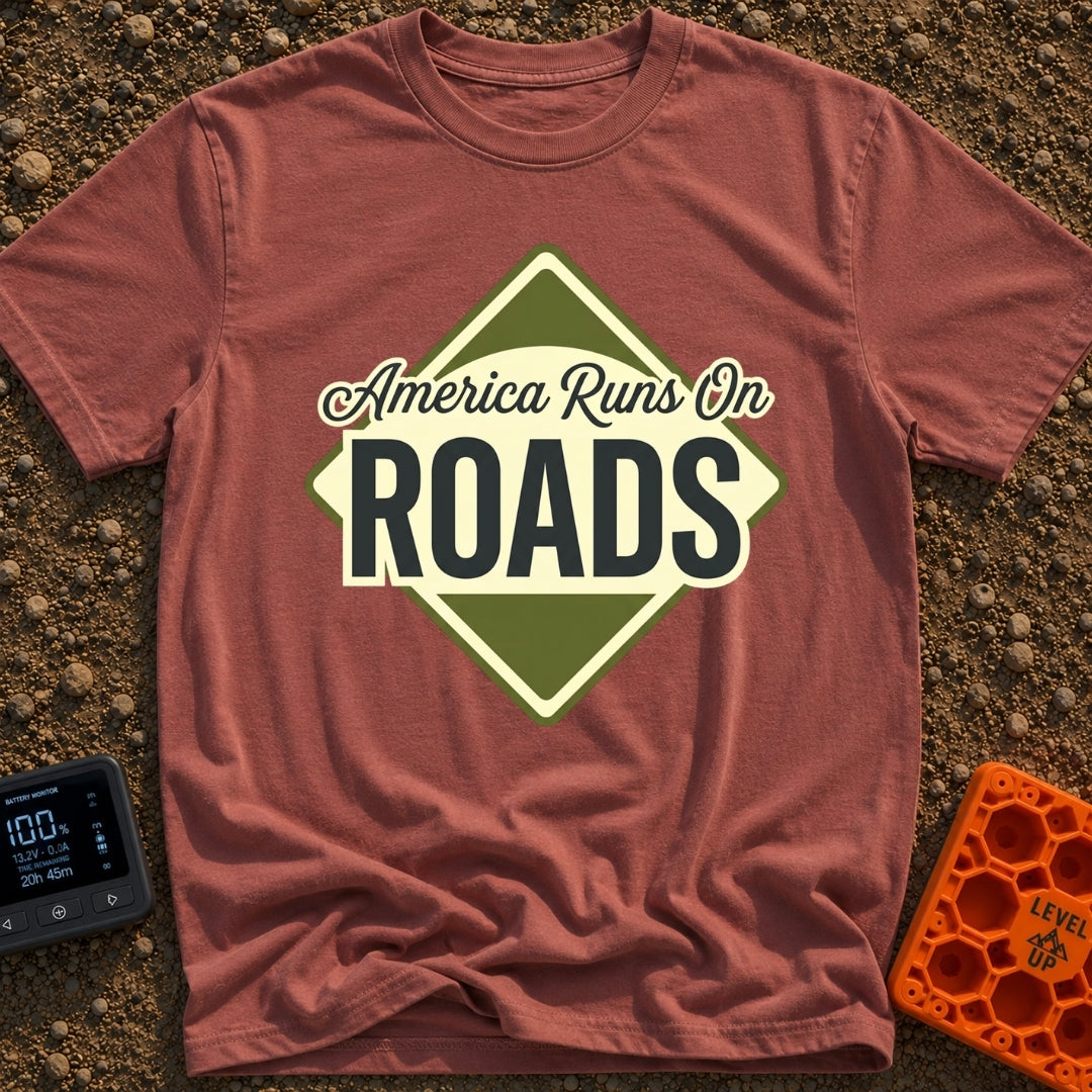 America runs On Roads - T-Shirt in Brick - A diamond-shaped, olive green and pale yellow graphic resembling a road sign...