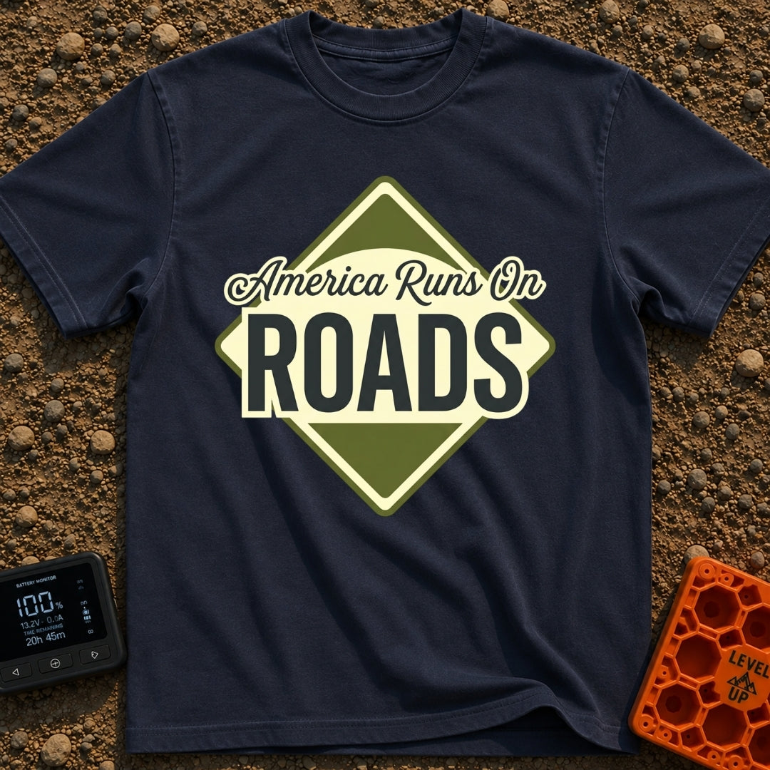America runs On Roads - T-Shirt in Navy - A diamond-shaped, olive green and pale yellow graphic resembling a road sign...