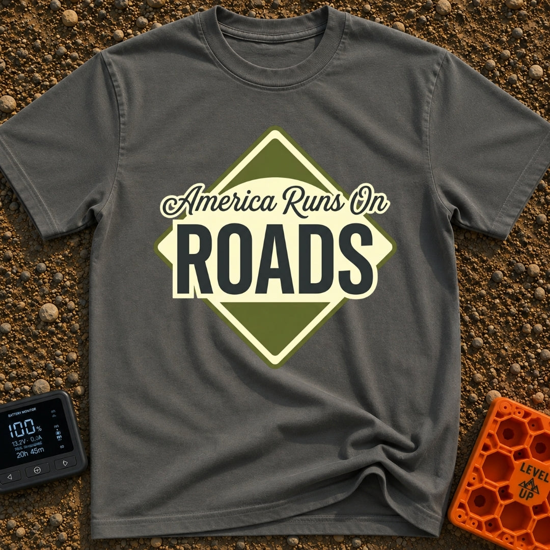 America runs On Roads - T-Shirt in Pepper - A diamond-shaped, olive green and pale yellow graphic resembling a road sign...