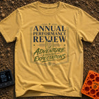 Adventure Exceeds Expectations - T-Shirt in Mustard - A typographic badge design featuring the text 'ANNUAL PERFORMANCE...