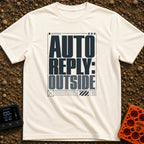 Auto Reply Outside - T-Shirt in Ivory - A typographic design featuring the large, stacked bold text "AUTO REPLY: OUTSIDE"...