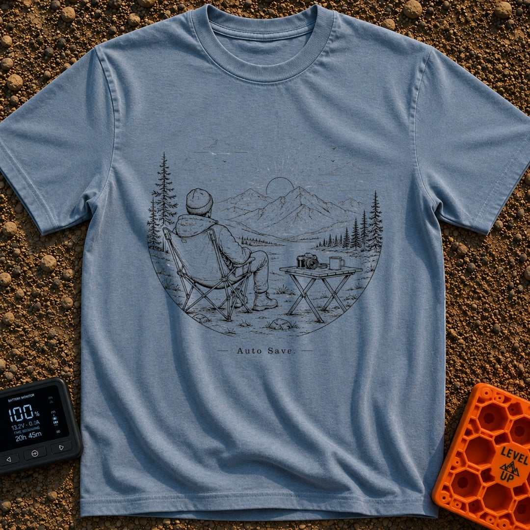 Auto Save In Progress - T-Shirt in Blue Jean - A black and white line drawing of a person sitting in a camp chair facing...