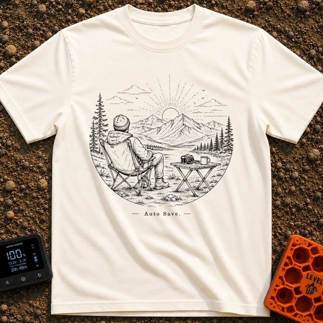 Auto Save In Progress - T-Shirt in Ivory - A black and white line drawing of a person sitting in a camp chair facing away...