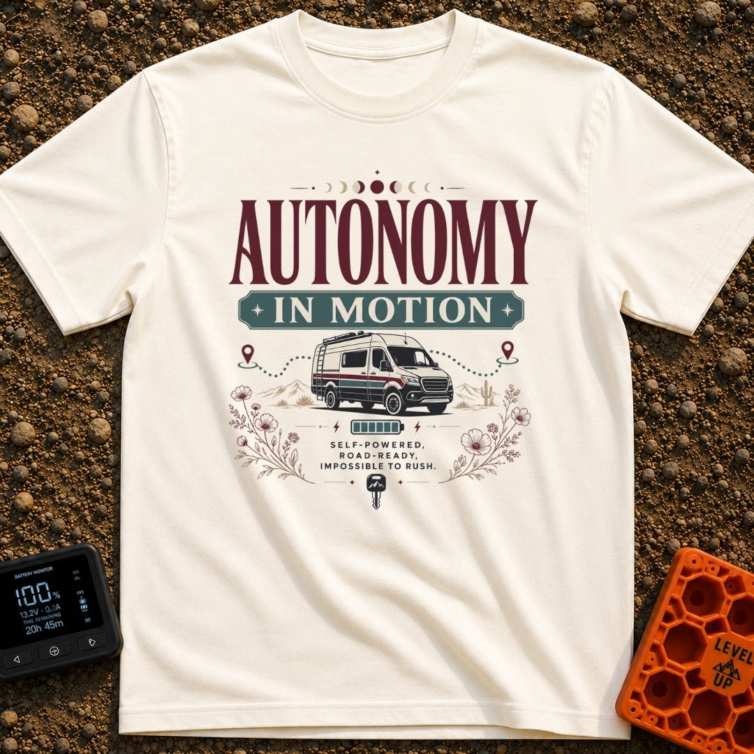 Autonomy In Motion - T-Shirt in Ivory - A vintage-style illustration of a camper van driving through a desert landscape...