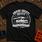 Awning Anxiety Club - T-Shirt in Black - A black and white illustration of a camper van with its side awning extended,...