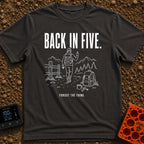 Back In Five Years - T-Shirt in Graphite - White line art on a black background showing a hiker with a backpack walking...