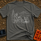 Running In The Background - T-Shirt in Pepper - A line-art illustration of a man wearing a beanie sitting in a camp chair...