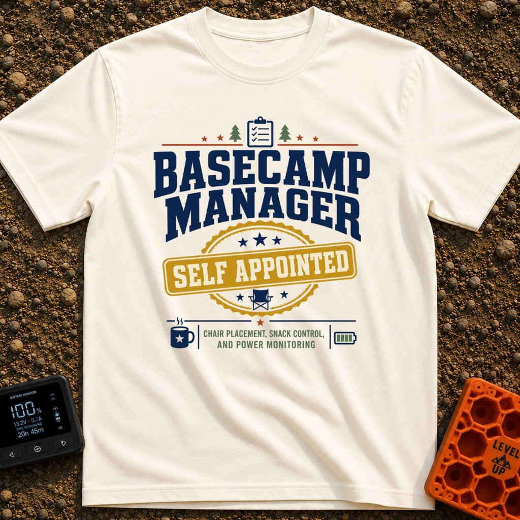Self Appointed Basecamp Manager - T-Shirt in Ivory - A typographic design reading 'BASECAMP MANAGER' in large navy...