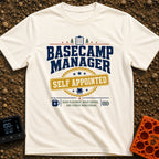 Self Appointed Basecamp Manager - T-Shirt in Ivory - A typographic design reading 'BASECAMP MANAGER' in large navy...