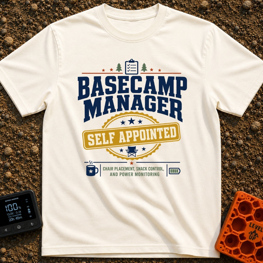 Self Appointed Basecamp Manager - T-Shirt in Ivory - A typographic design reading 'BASECAMP MANAGER' in large navy...