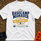Self Appointed Basecamp Manager - T-Shirt in White - A typographic design reading 'BASECAMP MANAGER' in large navy...