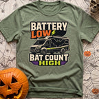Battery Low Bats High - T-Shirt in Moss - A black Class C camper van or RV is shown with a large silhouette of a bat with...