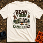 Bean There Camped That - T-Shirt in Ivory - The artwork features a Class C motorhome parked next to a green tent and a...