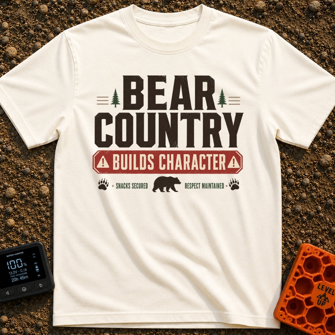 Character In Bearland - T-Shirt in Ivory - A vintage-style typographic design featuring the text "BEAR COUNTRY BUILDS...