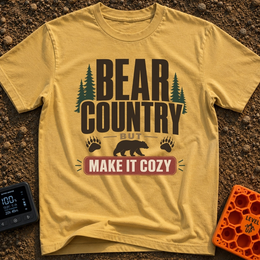 Cozy Bear Country - T-Shirt in Mustard - The design features the text 'BEAR COUNTRY BUT MAKE IT COZY' in bold typography,...