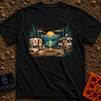 Then And Now - T-Shirt in Black - A detailed illustration of a campsite by a mountain lake at sunset, comparing a vintage...
